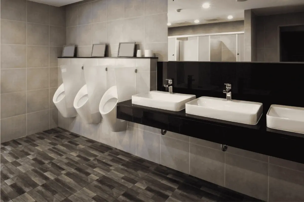 Commercial bathroom plumbing installation in Ogden, Utah completed by Utah Mechanical Systems — modern sinks and urinals installed by licensed commercial plumbing contractors ensuring code-compliant, high-efficiency performance.
