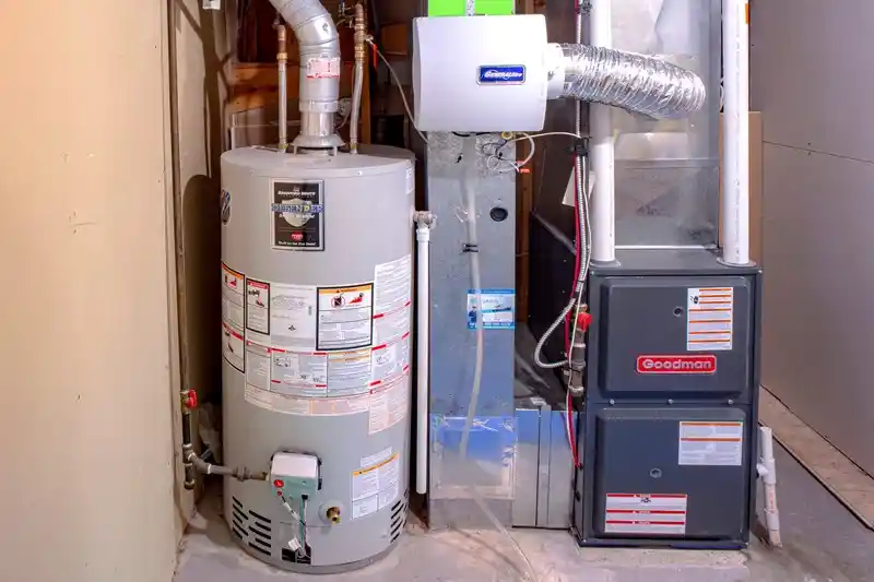 Goodman furnace and Bradford White water heater inside a Layton Utah home during HVAC repair and installation service by local technicians