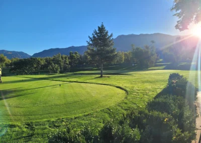 Green fairway at Ogden Golf and Country Club near South Ogden with mountain views and manicured landscaping in the background